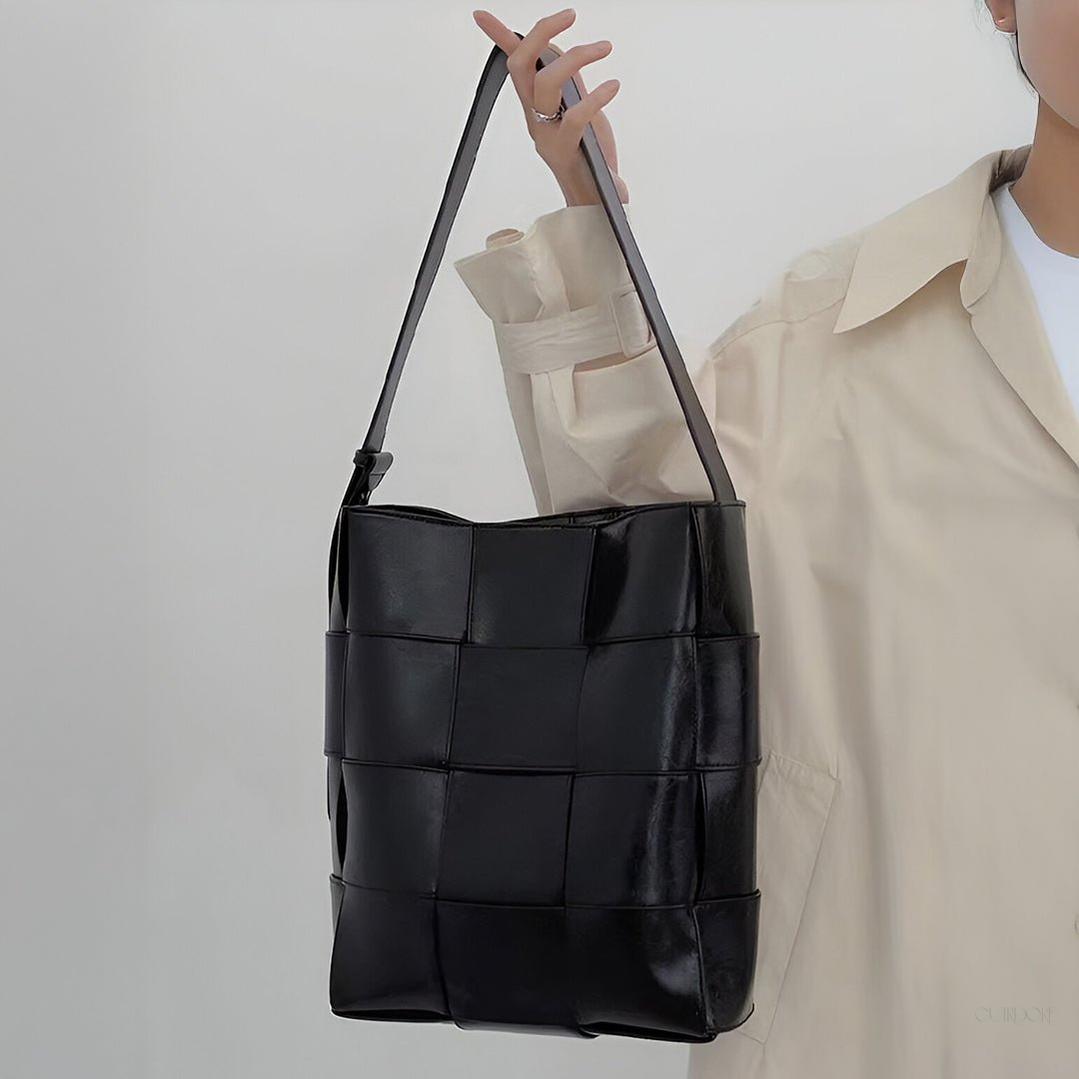 Black Glossy Woven Handbag — Modern structure with elevated shine