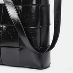 Black Glossy Woven Handbag — Modern structure with elevated shine