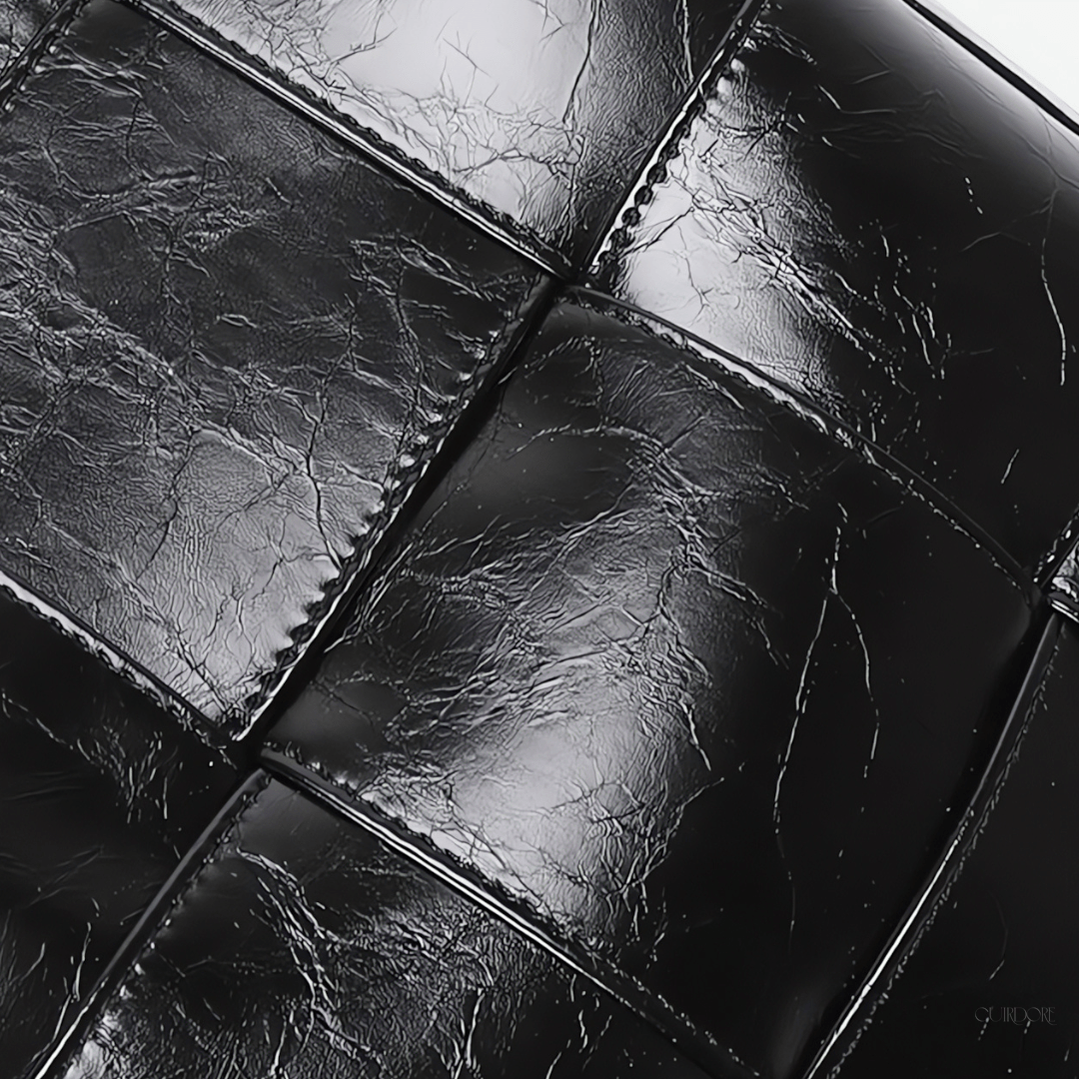 Black Glossy Woven Handbag — Modern structure with elevated shine
