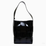 Black Glossy Woven Handbag — Modern structure with elevated shine