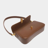 Elegant Baguette Handbag with Gold Lock Closure