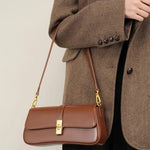 Elegant Baguette Handbag with Gold Lock Closure