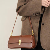 Elegant Baguette Handbag with Gold Lock Closure