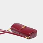 Elegant Baguette Handbag with Gold Lock Closure