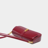 Elegant Baguette Handbag with Gold Lock Closure