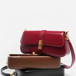 Elegant Baguette Handbag with Gold Lock Closure