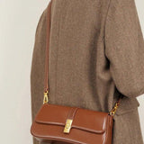 Elegant Baguette Handbag with Gold Lock Closure