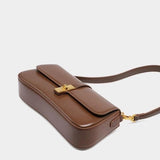 Elegant Baguette Handbag with Gold Lock Closure