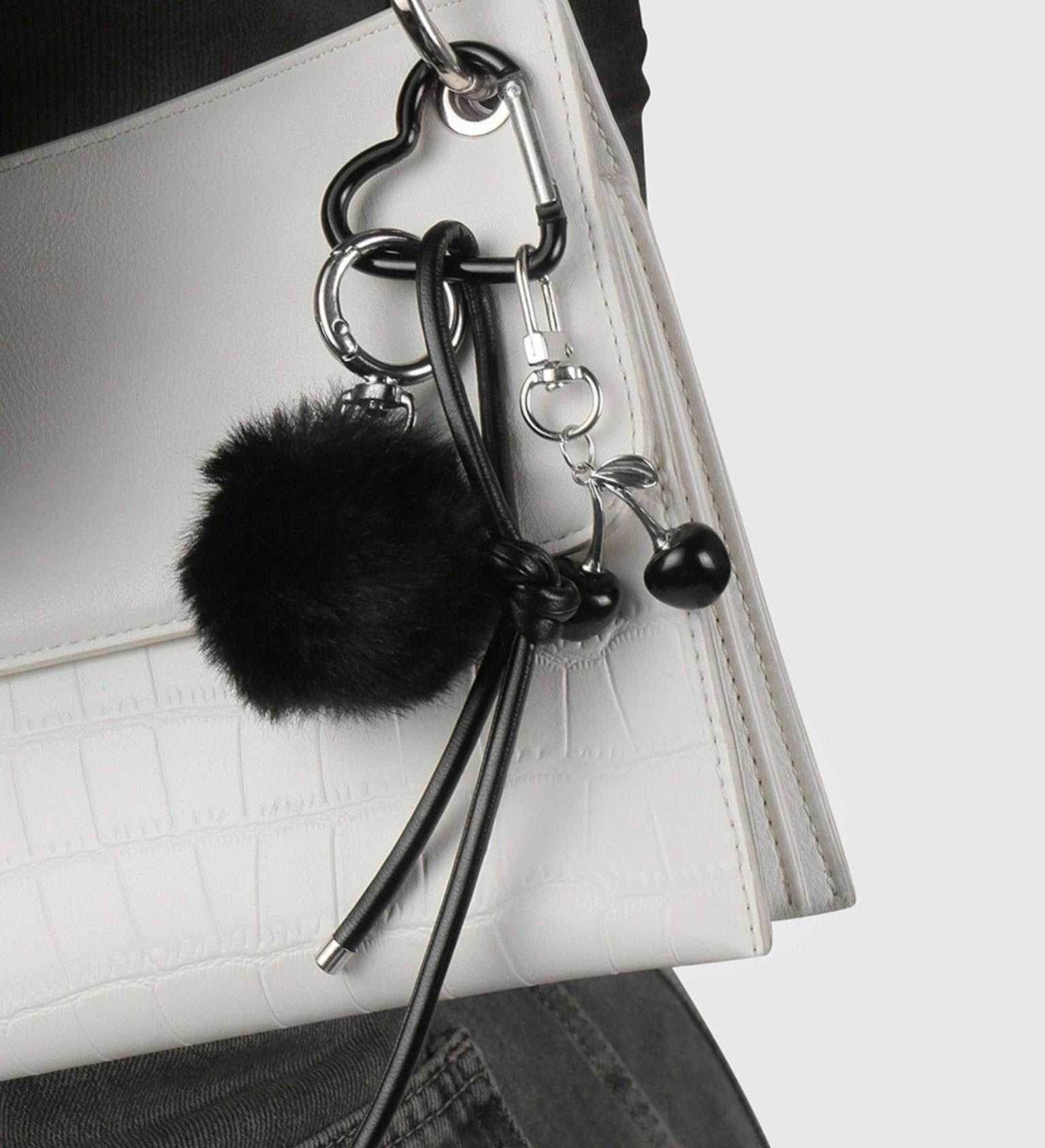 Praelia Black Pom-Pom Heart BagCharm – Chic, Modern & Playful